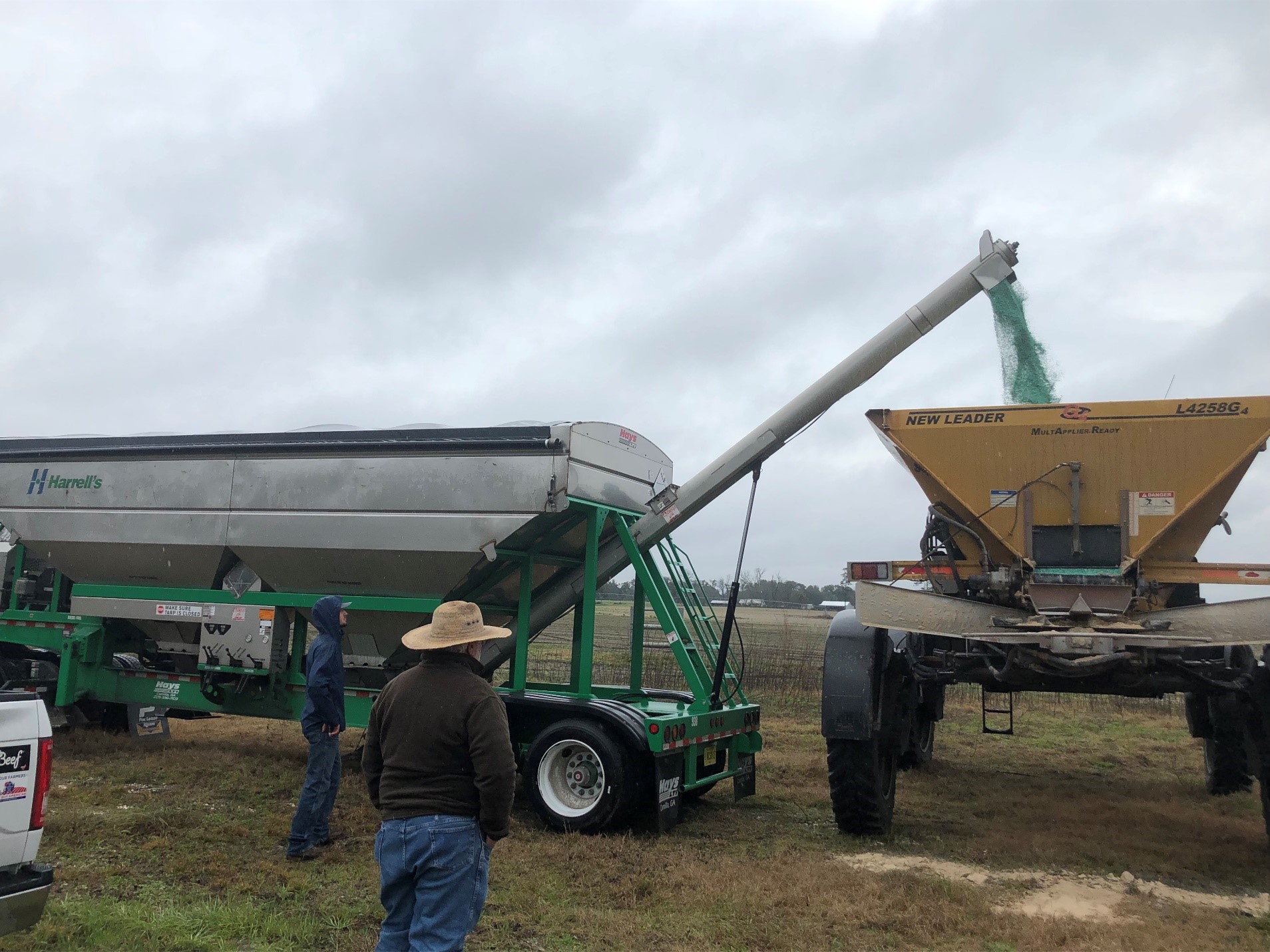 adding POLYON fertilizer to a spreader